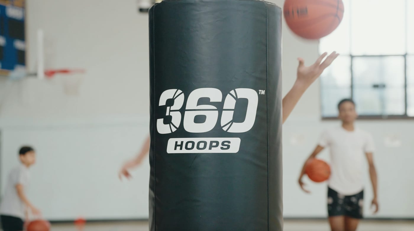 Custom 360 Hoops branded pole pad on court