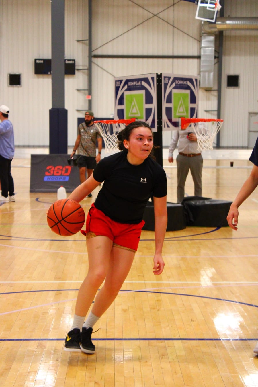 Player dribbling on a 360 Hoops court